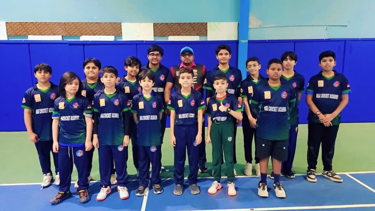 Coach Zaheer Maqsood with the MAX Sports U13 team